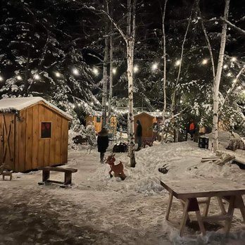 Winter wonderland outdoor market with string lights behind the store